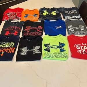 Very good condition Boys Youth Medium Under Armour shirts. All 12 for$80 obo